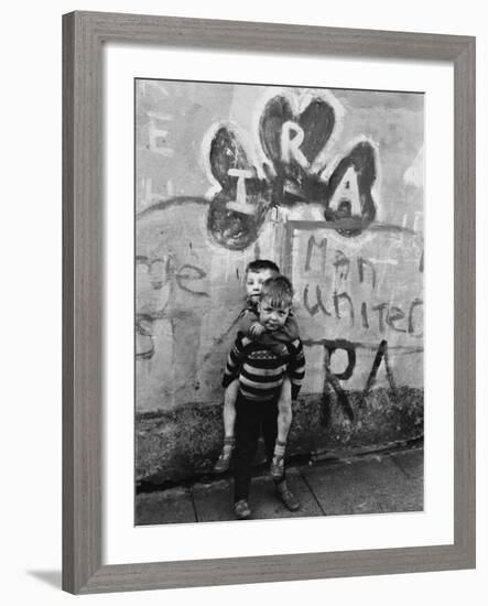 Two Dirty Boys Stand in Front of Ira Graffiti in Northern Ireland-null-Framed Photographic Print