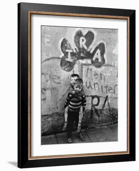 Two Dirty Boys Stand in Front of Ira Graffiti in Northern Ireland-null-Framed Photographic Print