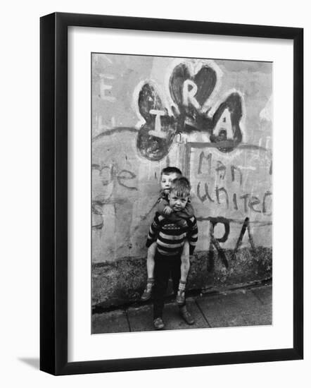 Two Dirty Boys Stand in Front of Ira Graffiti in Northern Ireland-null-Framed Photographic Print