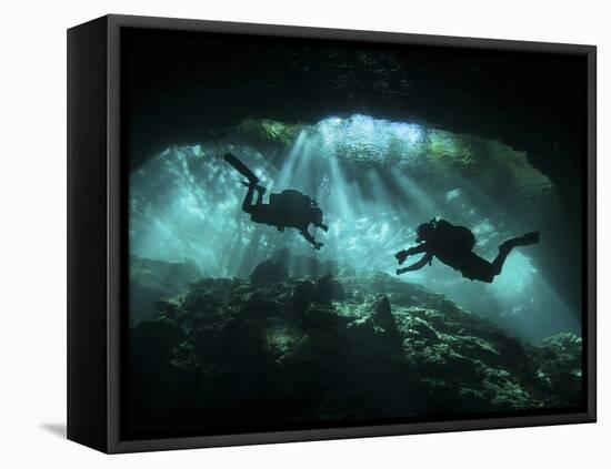 Two Divers Silhouetted in Light at Entrance to Chac Mool Cenote, Mexico-null-Framed Premier Image Canvas