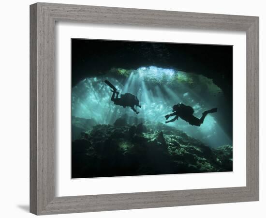 Two Divers Silhouetted in Light at Entrance to Chac Mool Cenote, Mexico-null-Framed Photographic Print