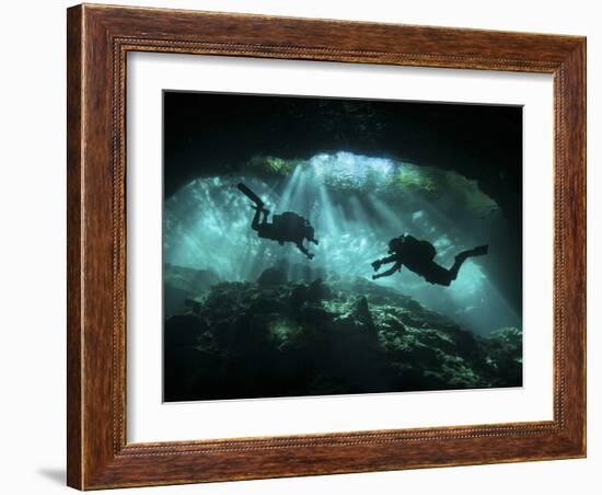 Two Divers Silhouetted in Light at Entrance to Chac Mool Cenote, Mexico-null-Framed Photographic Print