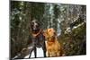 Two Dogs Look Sideways On A Snowy Forest Trail-Hannah Dewey-Mounted Photographic Print