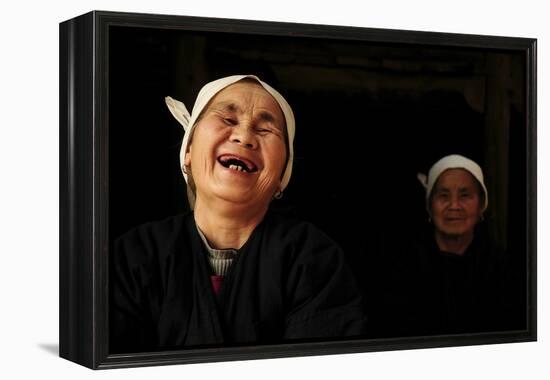 Two Dong Women, One Laughing, in a Dark Room, Sanjiang Dong Village, Guangxi, China-Enrique Lopez-Tapia-Framed Premier Image Canvas