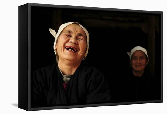 Two Dong Women, One Laughing, in a Dark Room, Sanjiang Dong Village, Guangxi, China-Enrique Lopez-Tapia-Framed Premier Image Canvas