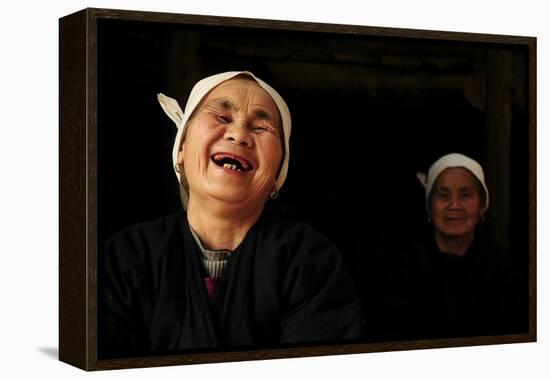 Two Dong Women, One Laughing, in a Dark Room, Sanjiang Dong Village, Guangxi, China-Enrique Lopez-Tapia-Framed Premier Image Canvas