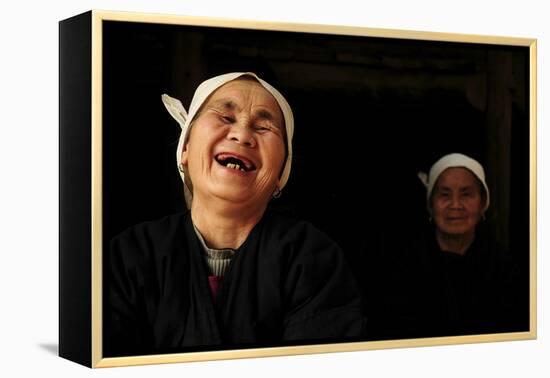 Two Dong Women, One Laughing, in a Dark Room, Sanjiang Dong Village, Guangxi, China-Enrique Lopez-Tapia-Framed Premier Image Canvas