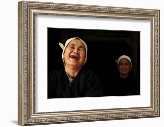 Two Dong Women, One Laughing, in a Dark Room, Sanjiang Dong Village, Guangxi, China-Enrique Lopez-Tapia-Framed Photographic Print