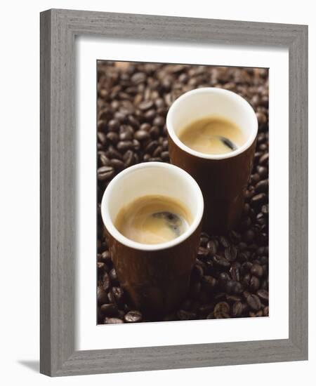 Two Espressos Standing on Coffee Beans-null-Framed Photographic Print