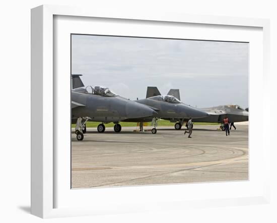 Two F-15's An An F-22 Raptor Parked On the Runway at Kadena Air Base, Japan-Stocktrek Images-Framed Photographic Print