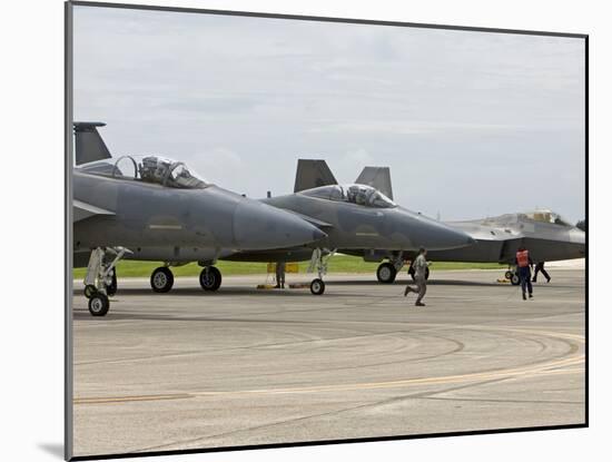 Two F-15's An An F-22 Raptor Parked On the Runway at Kadena Air Base, Japan-Stocktrek Images-Mounted Photographic Print