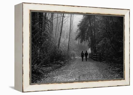 Two Figures Walking in Distance in Woodland-Sharon Wish-Framed Premier Image Canvas