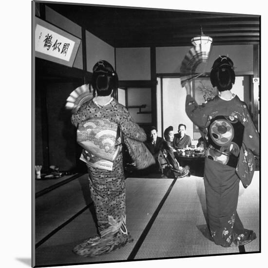 Two Geishas Dancing with Fans on Stage as Guests and Other Geshias Watch from Dinner Table-Alfred Eisenstaedt-Mounted Photographic Print