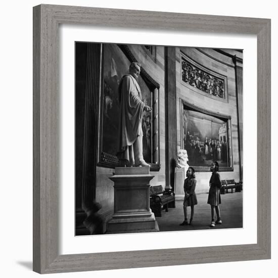 Two Girl Scouts Looking Up at Marble Statue of Abraham Lincoln, Rotunda of the Capitol Building-Alfred Eisenstaedt-Framed Photographic Print