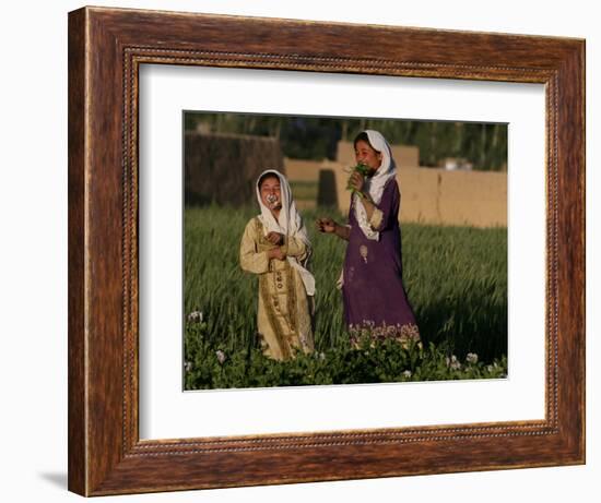 Two Girls Play in the Bamiyan Valley, Next to the Buddha Statue That was Destroyed, July 19, 2006-Rodrigo Abd-Framed Photographic Print