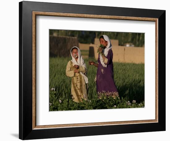 Two Girls Play in the Bamiyan Valley, Next to the Buddha Statue That was Destroyed, July 19, 2006-Rodrigo Abd-Framed Photographic Print