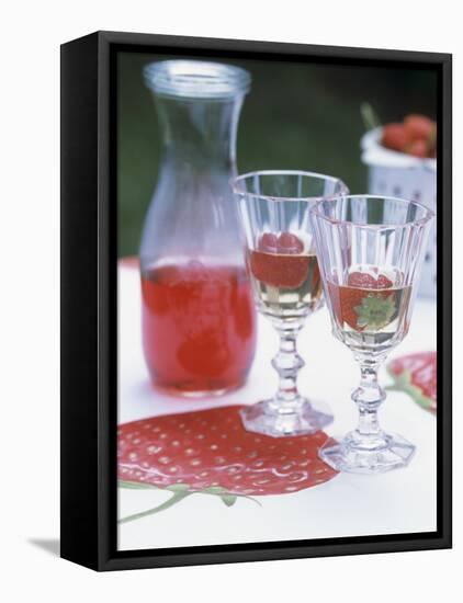 Two Glasses of Strawberry Wine on a Table in the Garden-Alena Hrbkova-Framed Premier Image Canvas
