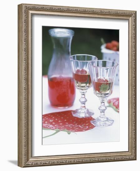 Two Glasses of Strawberry Wine on a Table in the Garden-Alena Hrbkova-Framed Photographic Print