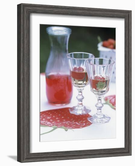 Two Glasses of Strawberry Wine on a Table in the Garden-Alena Hrbkova-Framed Photographic Print