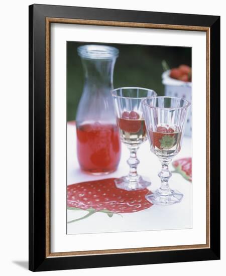 Two Glasses of Strawberry Wine on a Table in the Garden-Alena Hrbkova-Framed Photographic Print