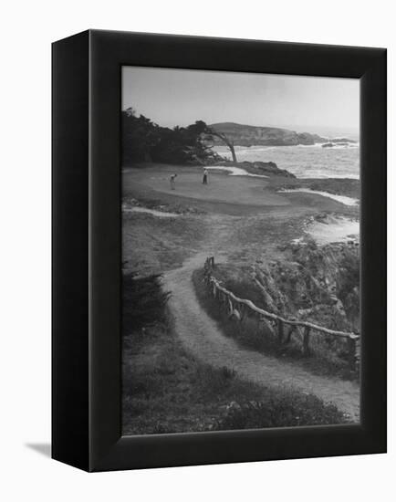 Two Golfers Playing on a Putting Green at Pebble Beach Golf Course-Nina Leen-Framed Premier Image Canvas