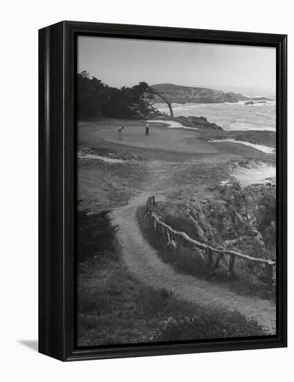 Two Golfers Playing on a Putting Green at Pebble Beach Golf Course-Nina Leen-Framed Premier Image Canvas