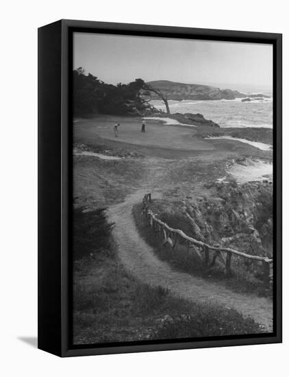 Two Golfers Playing on a Putting Green at Pebble Beach Golf Course-Nina Leen-Framed Premier Image Canvas