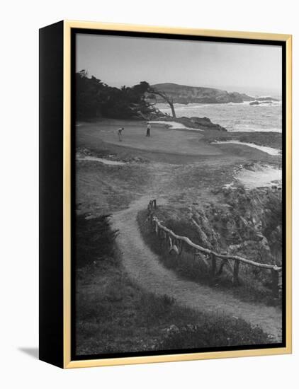 Two Golfers Playing on a Putting Green at Pebble Beach Golf Course-Nina Leen-Framed Premier Image Canvas