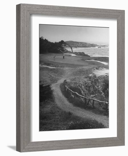 Two Golfers Playing on a Putting Green at Pebble Beach Golf Course-Nina Leen-Framed Photographic Print