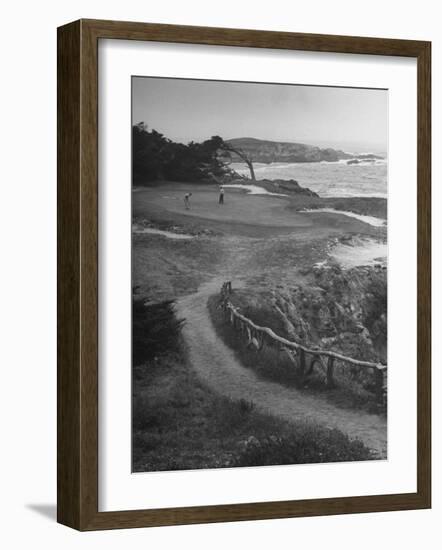 Two Golfers Playing on a Putting Green at Pebble Beach Golf Course-Nina Leen-Framed Photographic Print