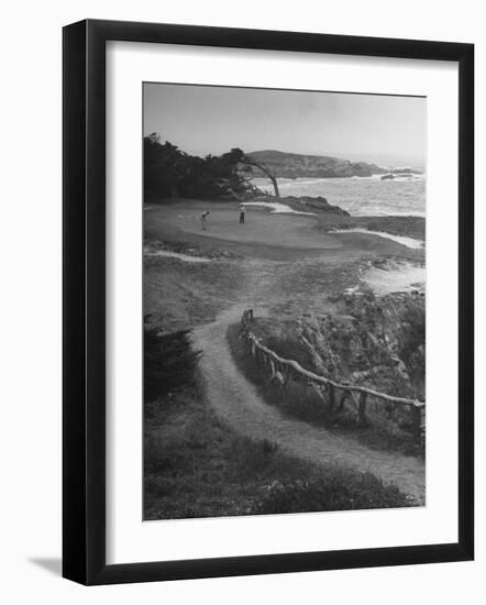 Two Golfers Playing on a Putting Green at Pebble Beach Golf Course-Nina Leen-Framed Photographic Print