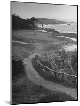 Two Golfers Playing on a Putting Green at Pebble Beach Golf Course-Nina Leen-Mounted Photographic Print