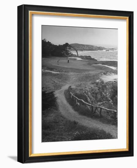 Two Golfers Playing on a Putting Green at Pebble Beach Golf Course-Nina Leen-Framed Photographic Print