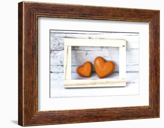 Two Hearts Made of Stone in Picture Frame-Uwe Merkel-Framed Photographic Print