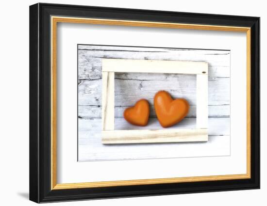 Two Hearts Made of Stone in Picture Frame-Uwe Merkel-Framed Photographic Print