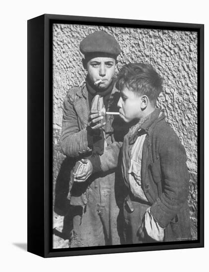 Two Homeless Boys Lighting Up American Cigarettes with British Matches-George Rodger-Framed Premier Image Canvas