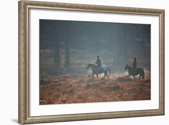 Two Horseback Riders Make their Way Through Misty Richmond Park in Winter-Alex Saberi-Framed Photographic Print