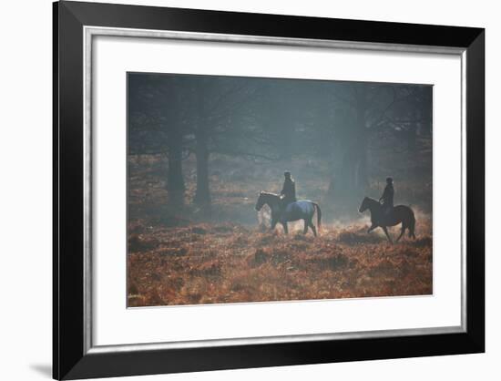 Two Horseback Riders Make their Way Through Misty Richmond Park in Winter-Alex Saberi-Framed Photographic Print