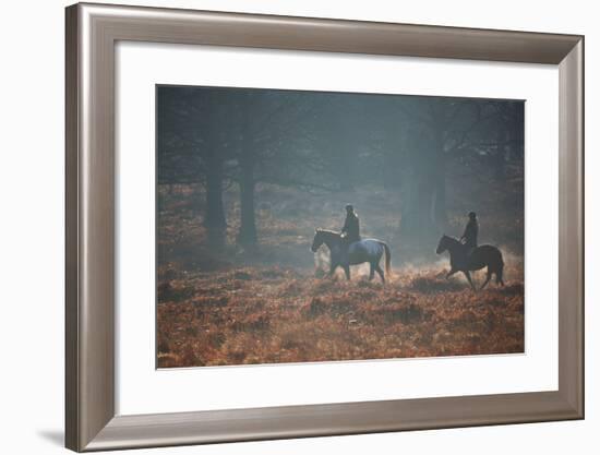 Two Horseback Riders Make their Way Through Misty Richmond Park in Winter-Alex Saberi-Framed Photographic Print