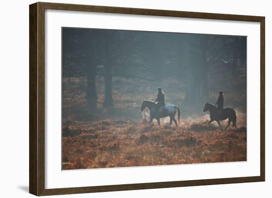 Two Horseback Riders Make their Way Through Misty Richmond Park in Winter-Alex Saberi-Framed Photographic Print