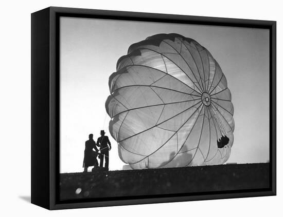 Two Irving Air Chute Co. Employees Struggling to Pull Down One of their Parachutes after Test Jump-Margaret Bourke-White-Framed Premier Image Canvas