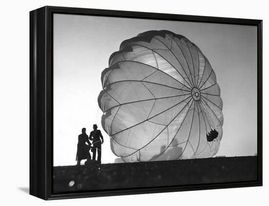 Two Irving Air Chute Co. Employees Struggling to Pull Down One of their Parachutes after Test Jump-Margaret Bourke-White-Framed Premier Image Canvas