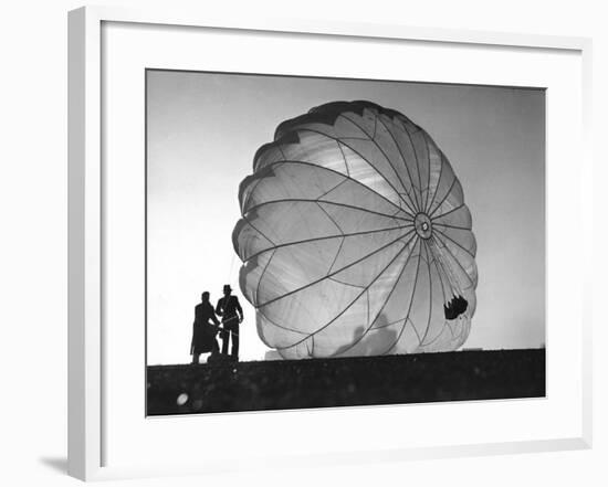 Two Irving Air Chute Co. Employees Struggling to Pull Down One of their Parachutes after Test Jump-Margaret Bourke-White-Framed Premium Photographic Print