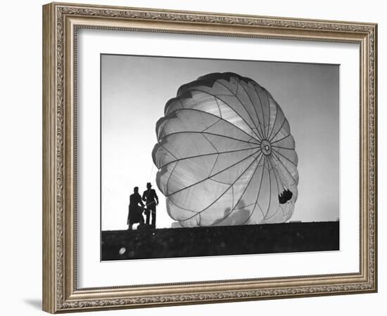 Two Irving Air Chute Co. Employees Struggling to Pull Down One of their Parachutes after Test Jump-Margaret Bourke-White-Framed Photographic Print