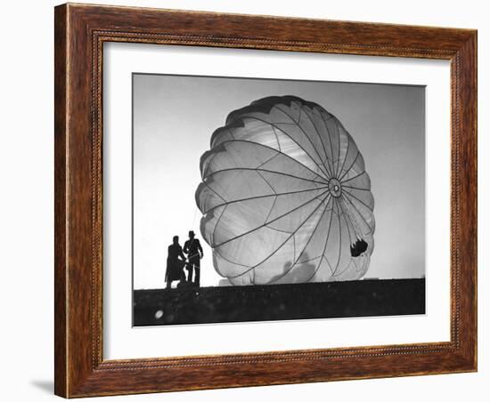 Two Irving Air Chute Co. Employees Struggling to Pull Down One of their Parachutes after Test Jump-Margaret Bourke-White-Framed Photographic Print