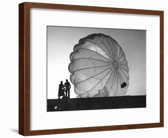 Two Irving Air Chute Co. Employees Struggling to Pull Down One of their Parachutes after Test Jump-Margaret Bourke-White-Framed Photographic Print
