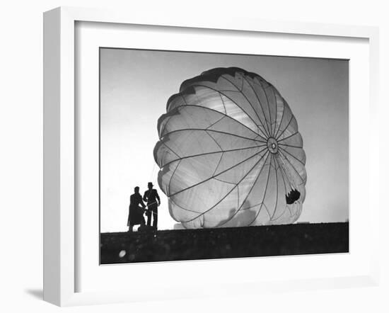 Two Irving Air Chute Co. Employees Struggling to Pull Down One of their Parachutes after Test Jump-Margaret Bourke-White-Framed Photographic Print