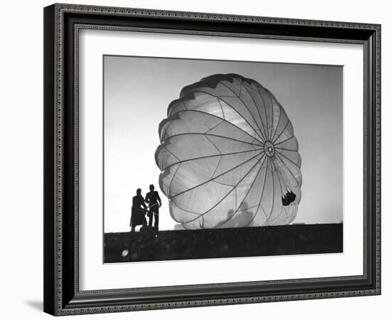 Two Irving Air Chute Co. Employees Struggling to Pull Down One of their Parachutes after Test Jump-Margaret Bourke-White-Framed Photographic Print