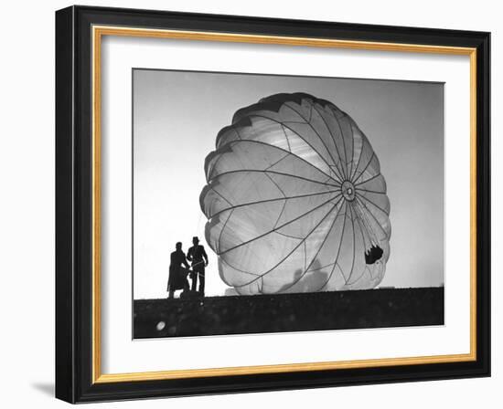 Two Irving Air Chute Co. Employees Struggling to Pull Down One of their Parachutes after Test Jump-Margaret Bourke-White-Framed Photographic Print