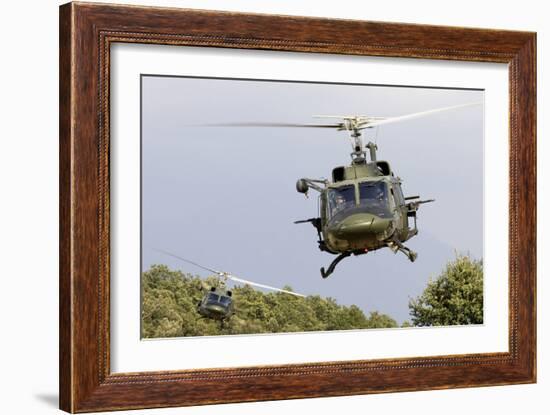 Two Italian Air Force Ab-212 Ico Helicopters Practice Low Level Flying-null-Framed Photographic Print